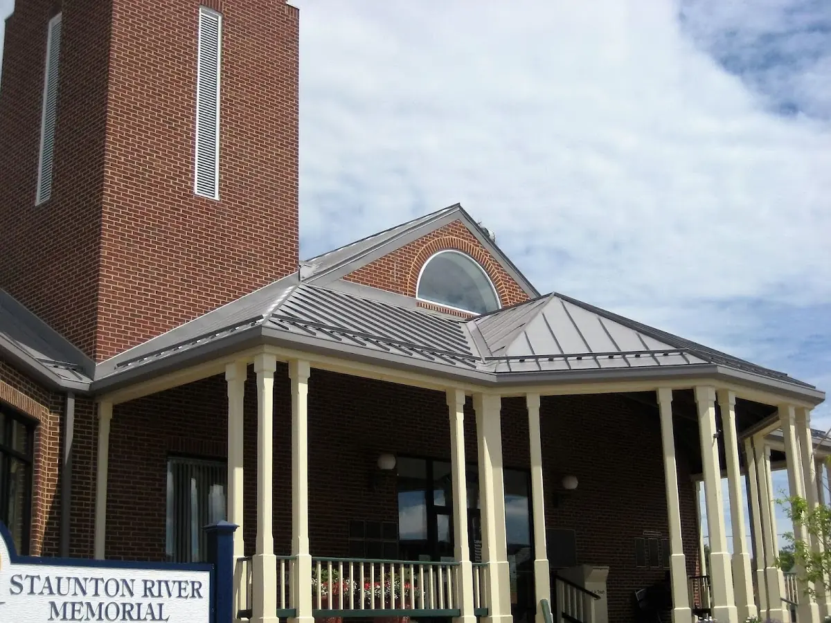 Skilled roofing craftsmen working on a residential roof in Crofton Commons